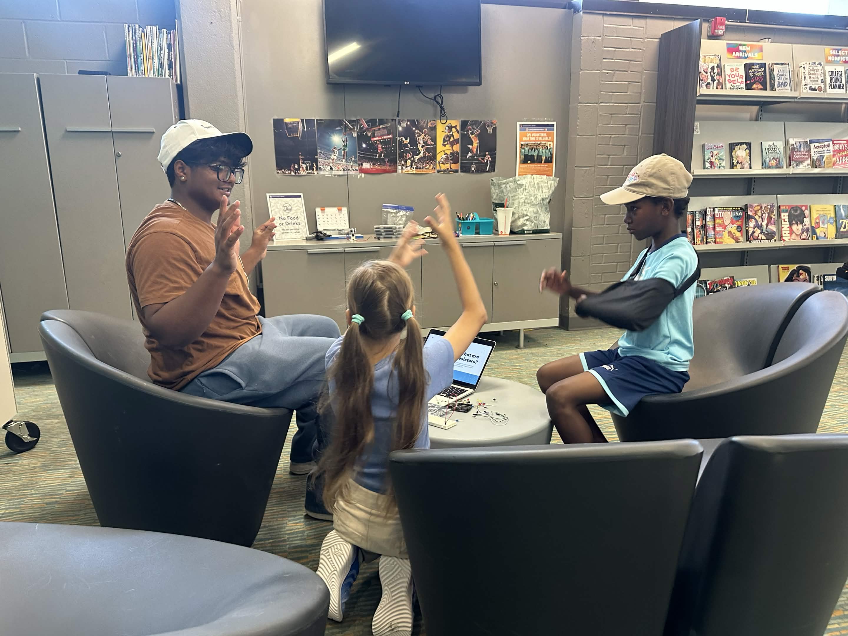 Mentor and students discussing a project together