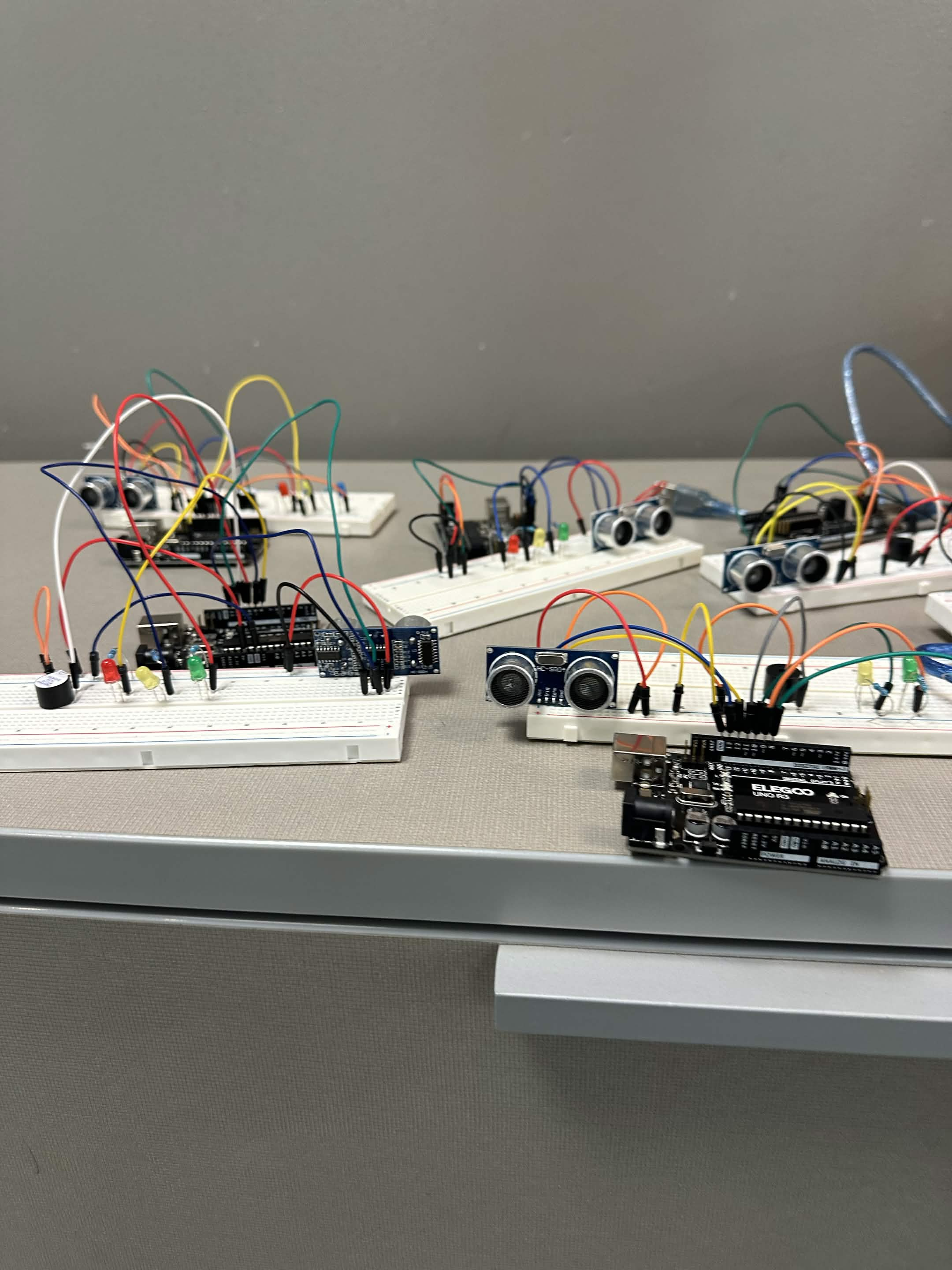 Breadboards wired with ultrasonic sensors and LEDs